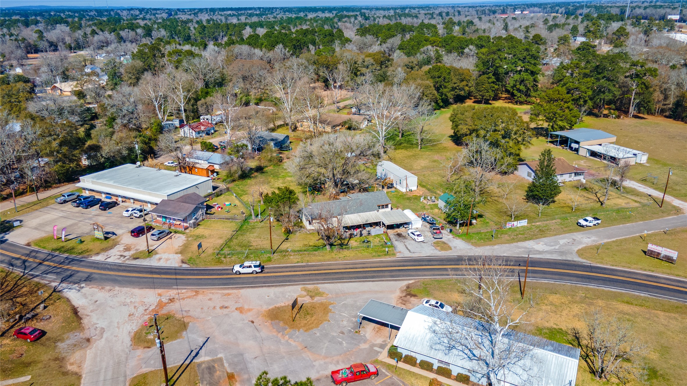 11281 Highway 150 Shepherd, TX 77371 - Photo 38 of 39 an aerial view of a house with a swimming pool