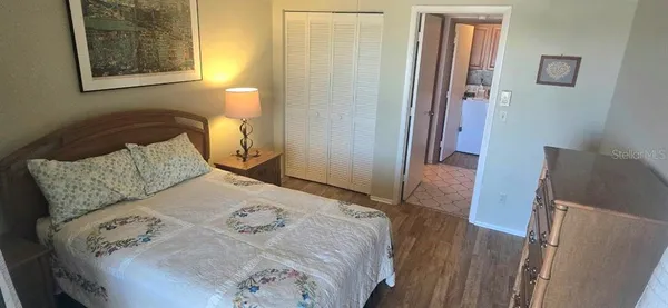 a bedroom with a bed and a dresser