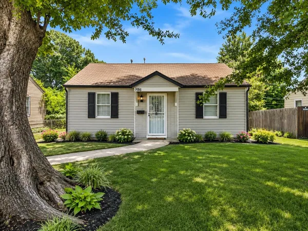 a view of a house with a yard