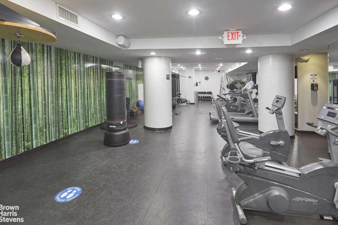 100 West 58th Street, Unit 5B Manhattan, NY 10019 - Photo 13 of 17 a view of a room with gym equipment