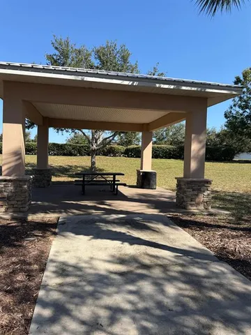 a view of a swimming pool with an outdoor seating