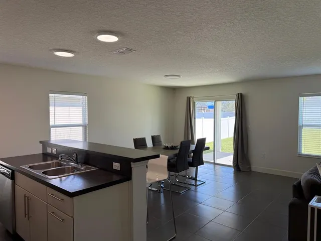 a kitchen with a stove and a window