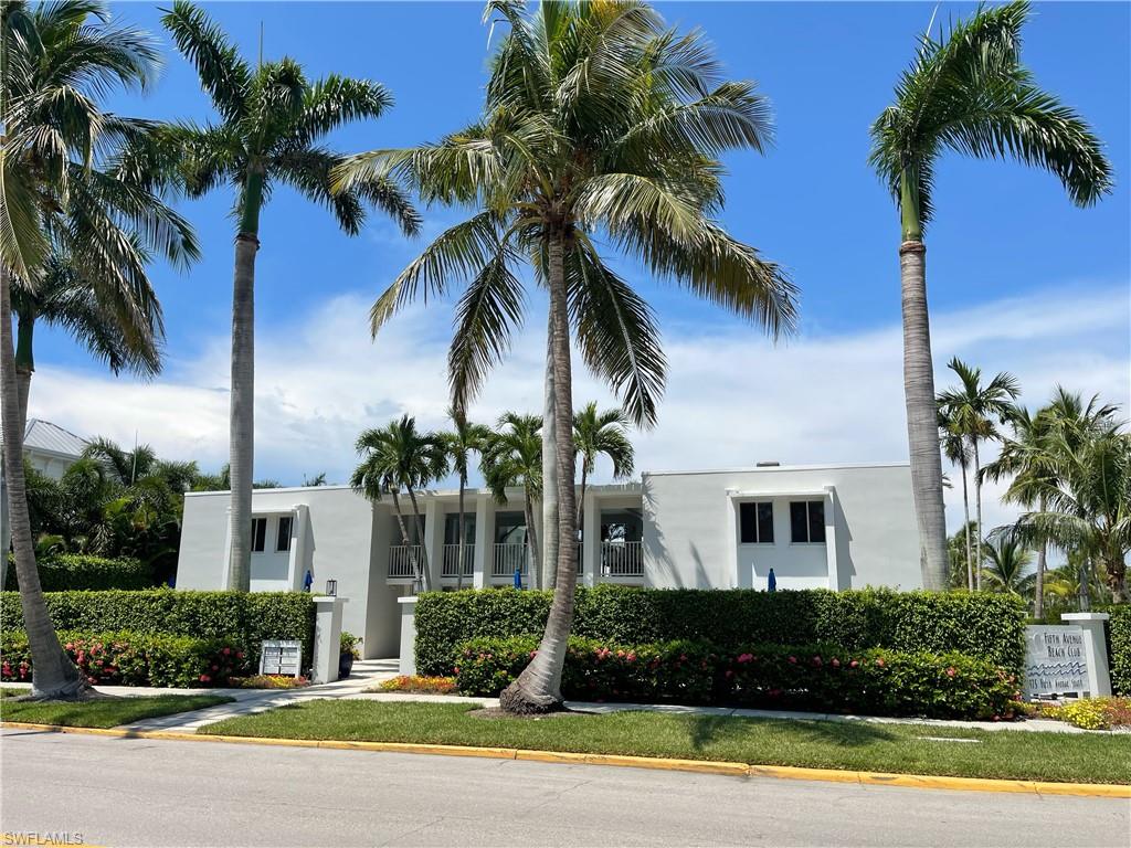 175 5th Avenue South, Unit 9 Naples, FL 34102 - Photo 1 of 19 a front view of house with yard and green space
