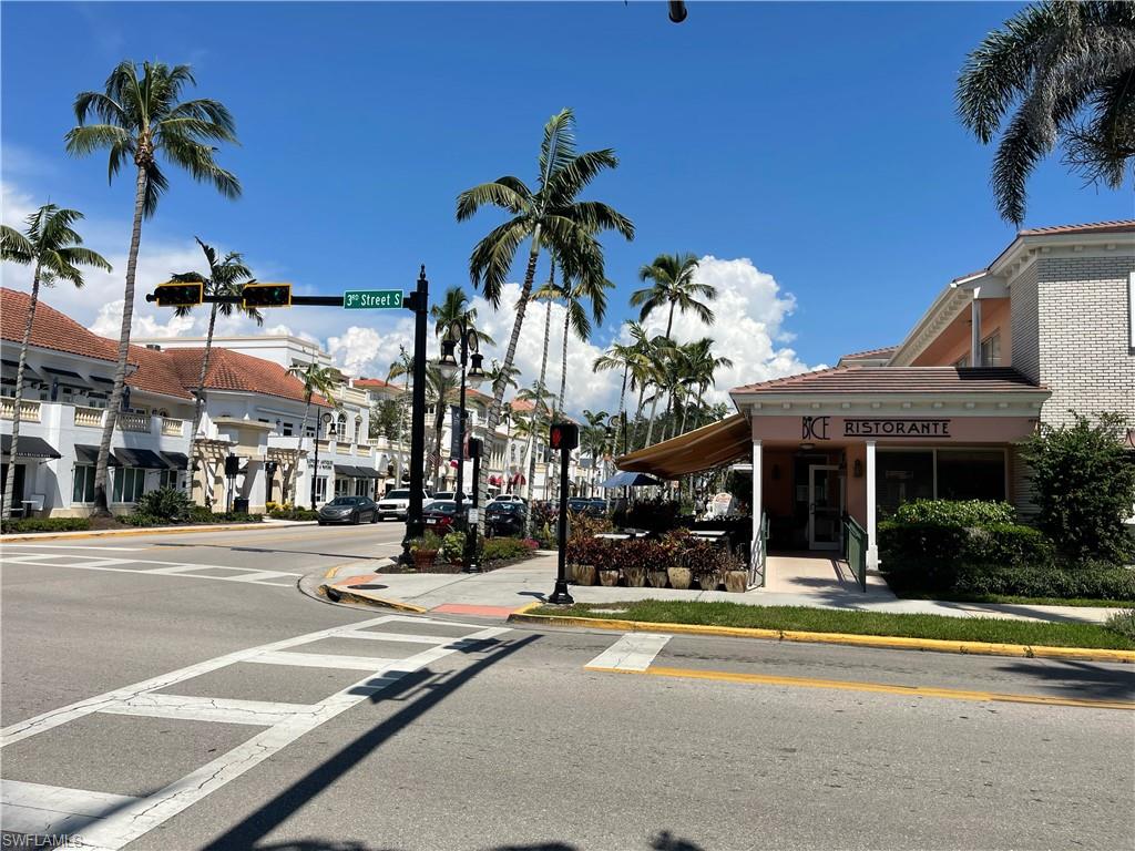 175 5th Avenue South, Unit 9 Naples, FL 34102 - Photo 17 of 19 a view of a building with a fountain and a pathway
