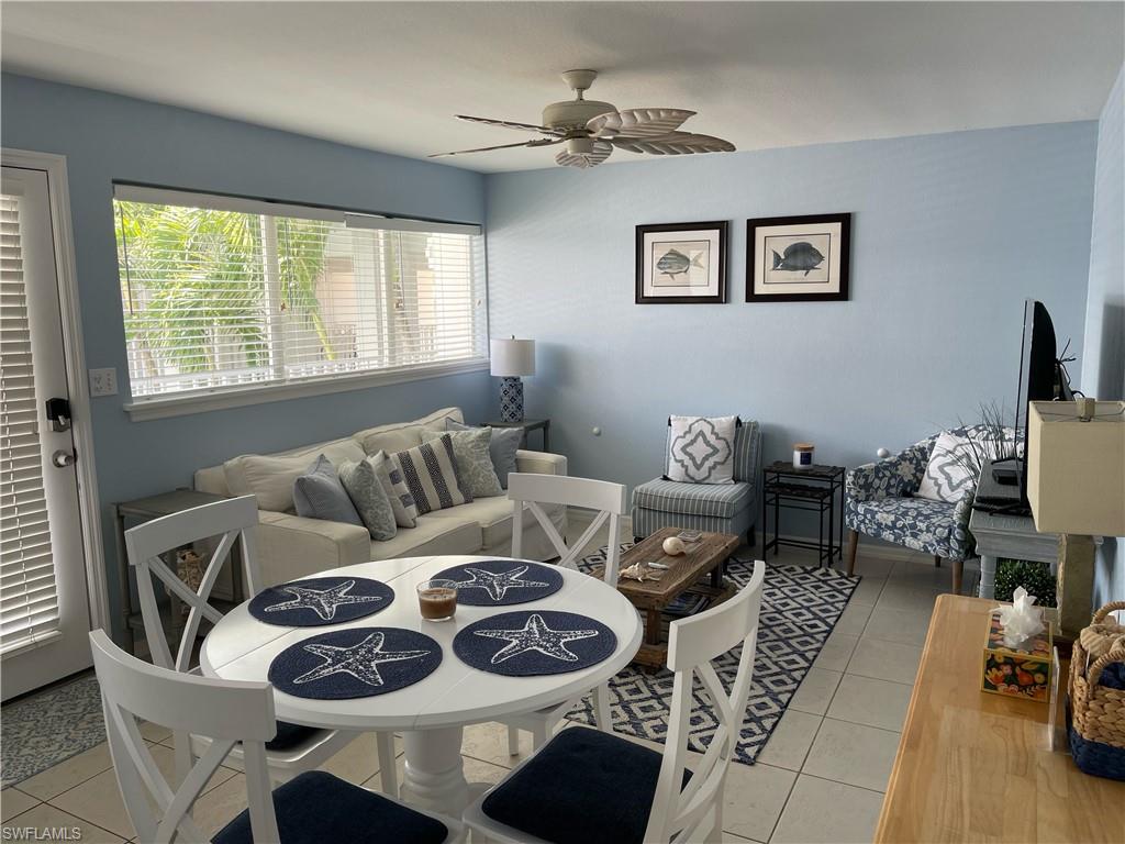 175 5th Avenue South, Unit 9 Naples, FL 34102 - Photo 2 of 19 a living room with furniture and a window