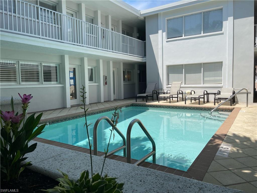 175 5th Avenue South, Unit 9 Naples, FL 34102 - Photo 10 of 19 a house with swimming pool in front of it