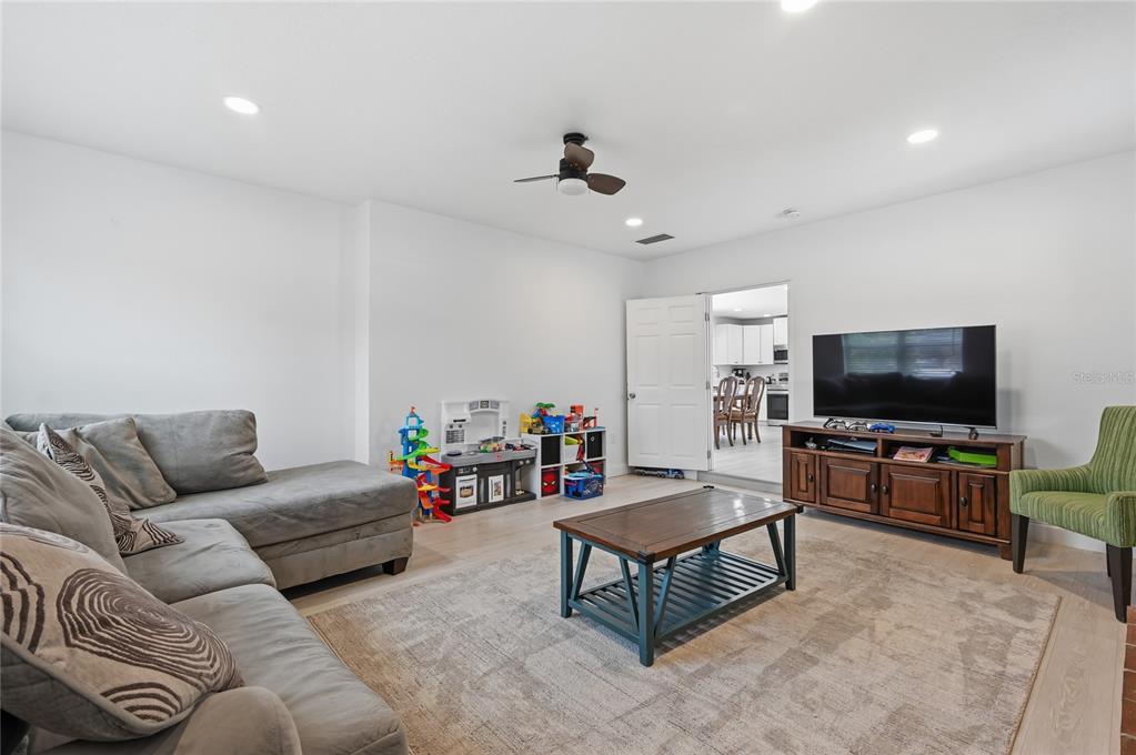 1946 Strathaven Road Winter Park, FL 32792 - Photo 4 of 37 a living room with furniture and a flat screen tv