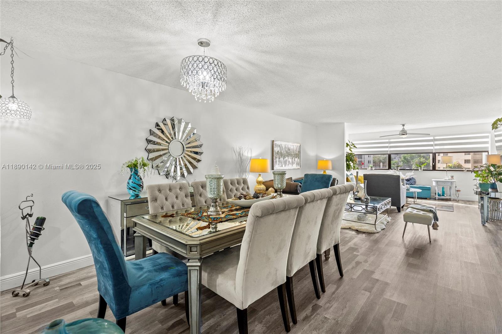 a view of a dining room with furniture window and wooden floor