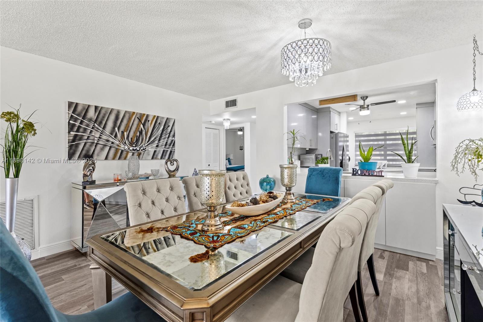 10400 Northwest 30th Court, Unit 202 Sunrise, FL 33322 - Photo 15 of 42 a living room with furniture and a chandelier