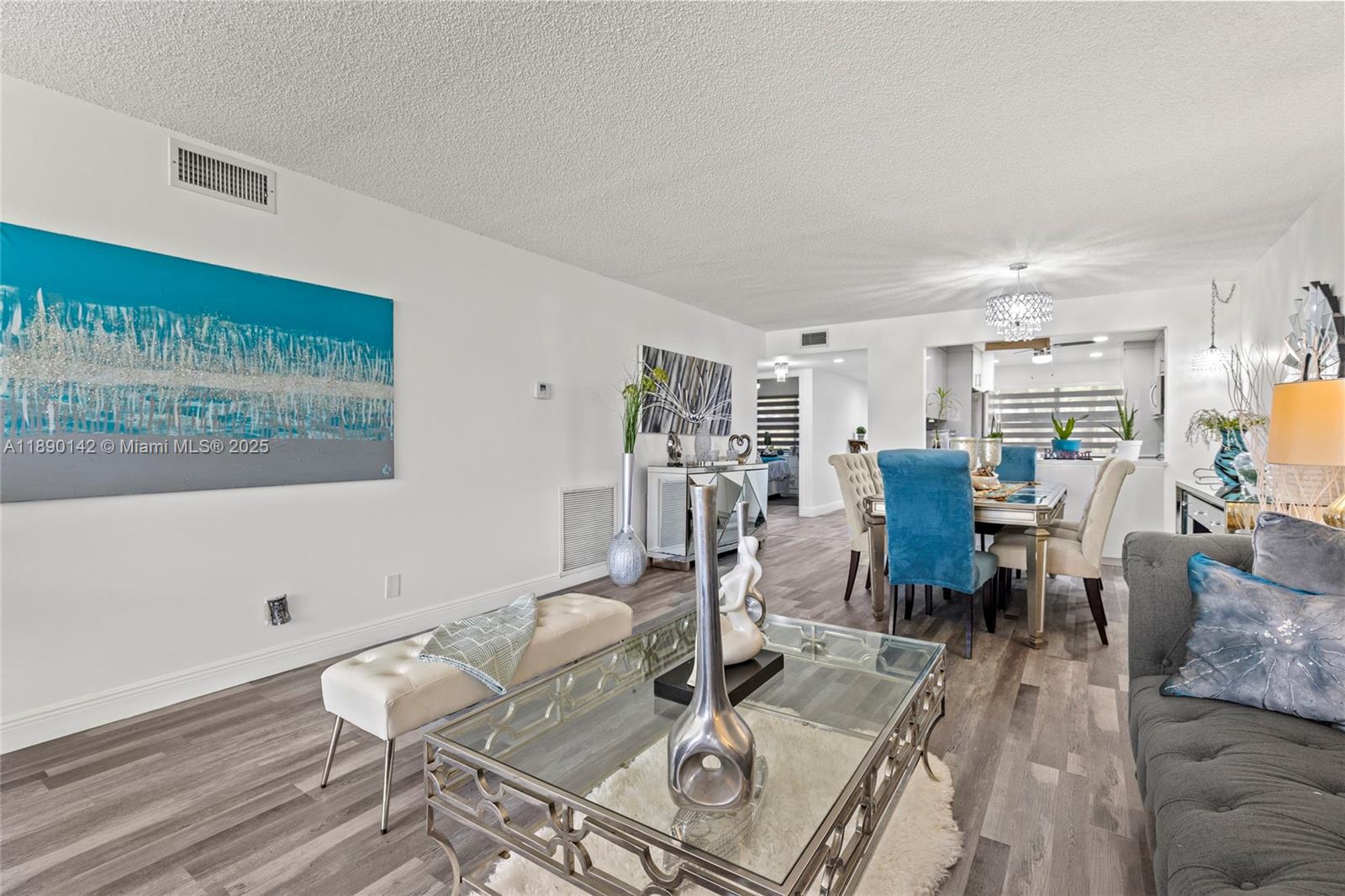 10400 Northwest 30th Court, Unit 202 Sunrise, FL 33322 - Photo 17 of 42 a view of a dining room with furniture window and wooden floor