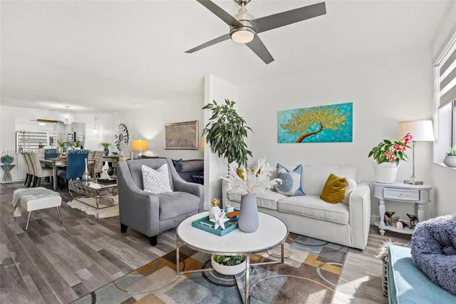 a living room with furniture and a rug