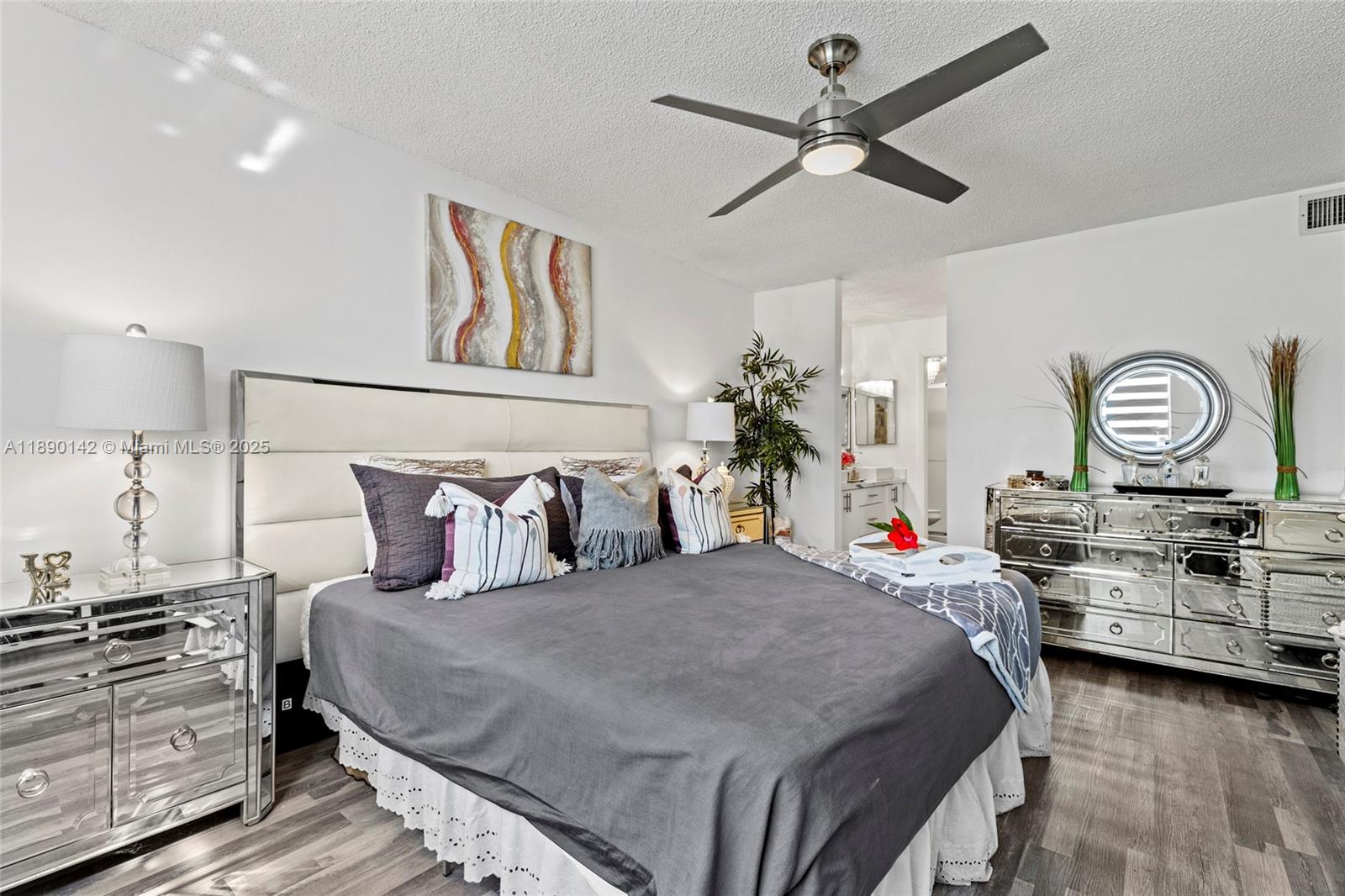 10400 Northwest 30th Court, Unit 202 Sunrise, FL 33322 - Photo 24 of 42 a bedroom with a bed and ceiling fan