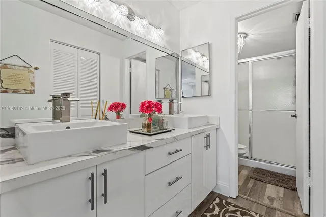 a bathroom with a sink and a mirror
