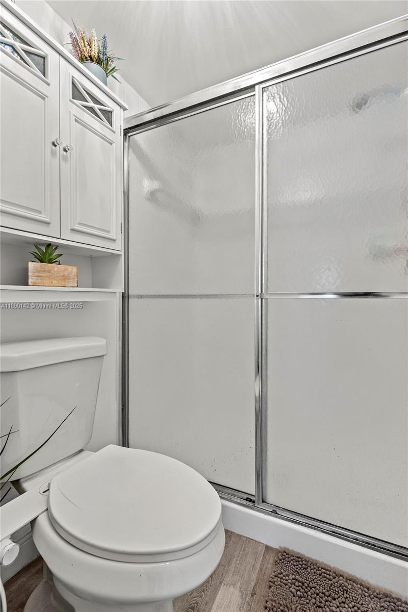 10400 Northwest 30th Court, Unit 202 Sunrise, FL 33322 - Photo 27 of 42 a bathroom with a shower and a toilet