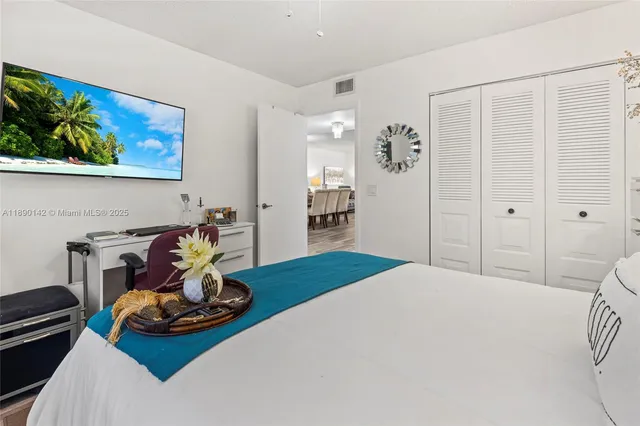 a bedroom with furniture and wooden floor