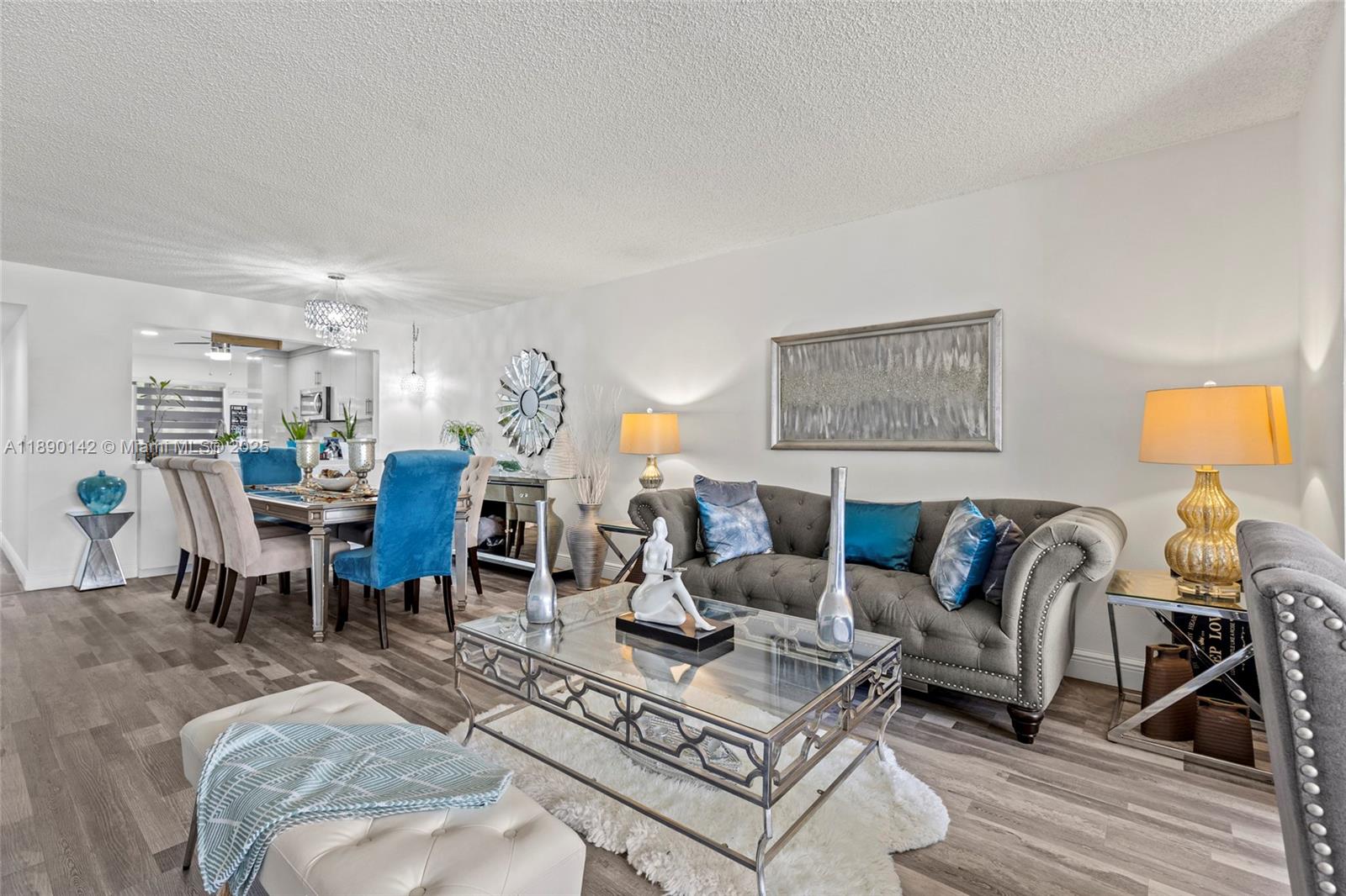 10400 Northwest 30th Court, Unit 202 Sunrise, FL 33322 - Photo 3 of 42 a living room with furniture and wooden floor