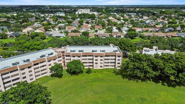 an aerial view of a house with a garden