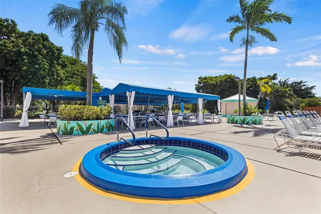 a view of a swimming pool with a patio