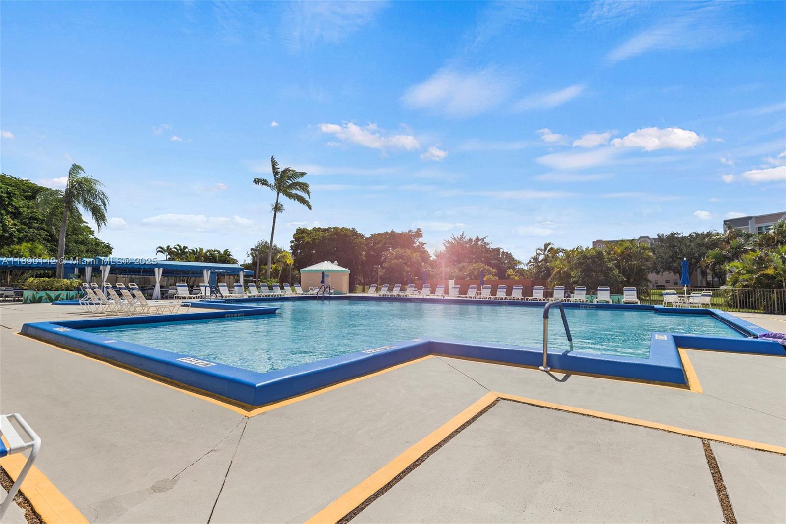 10400 Northwest 30th Court, Unit 202 Sunrise, FL 33322 - Photo 37 of 42 a view of a swimming pool with a lake