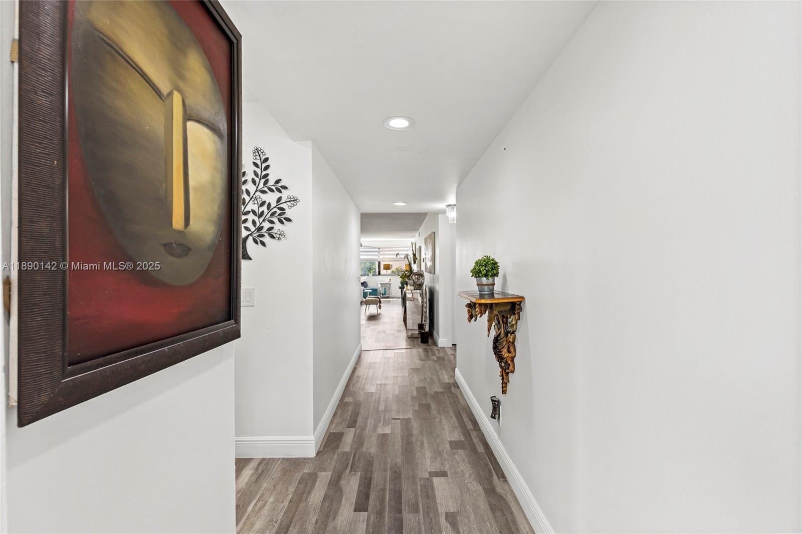 10400 Northwest 30th Court, Unit 202 Sunrise, FL 33322 - Photo 4 of 42 a view of a hallway with wooden floor and staircase