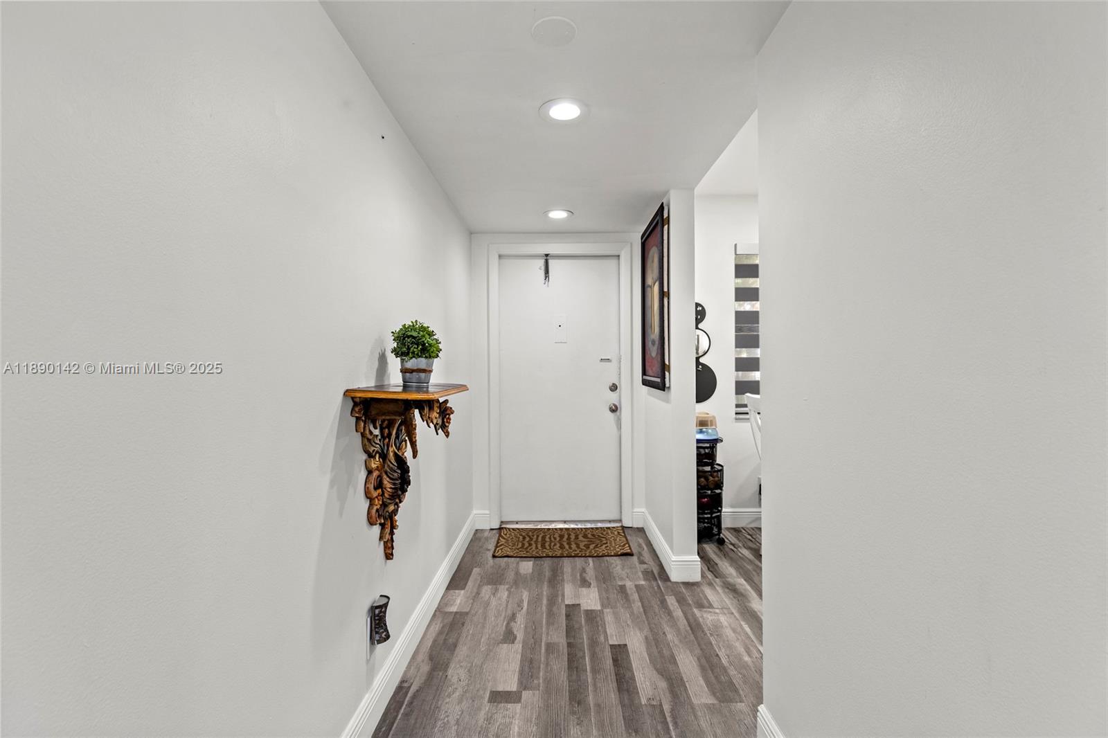 10400 Northwest 30th Court, Unit 202 Sunrise, FL 33322 - Photo 5 of 42 a view of hallway with wooden floor
