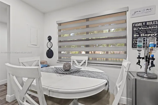 a dining room with table and chairs