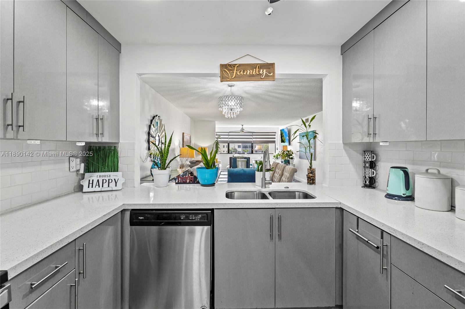 10400 Northwest 30th Court, Unit 202 Sunrise, FL 33322 - Photo 10 of 42 a kitchen with stainless steel appliances a sink and cabinets