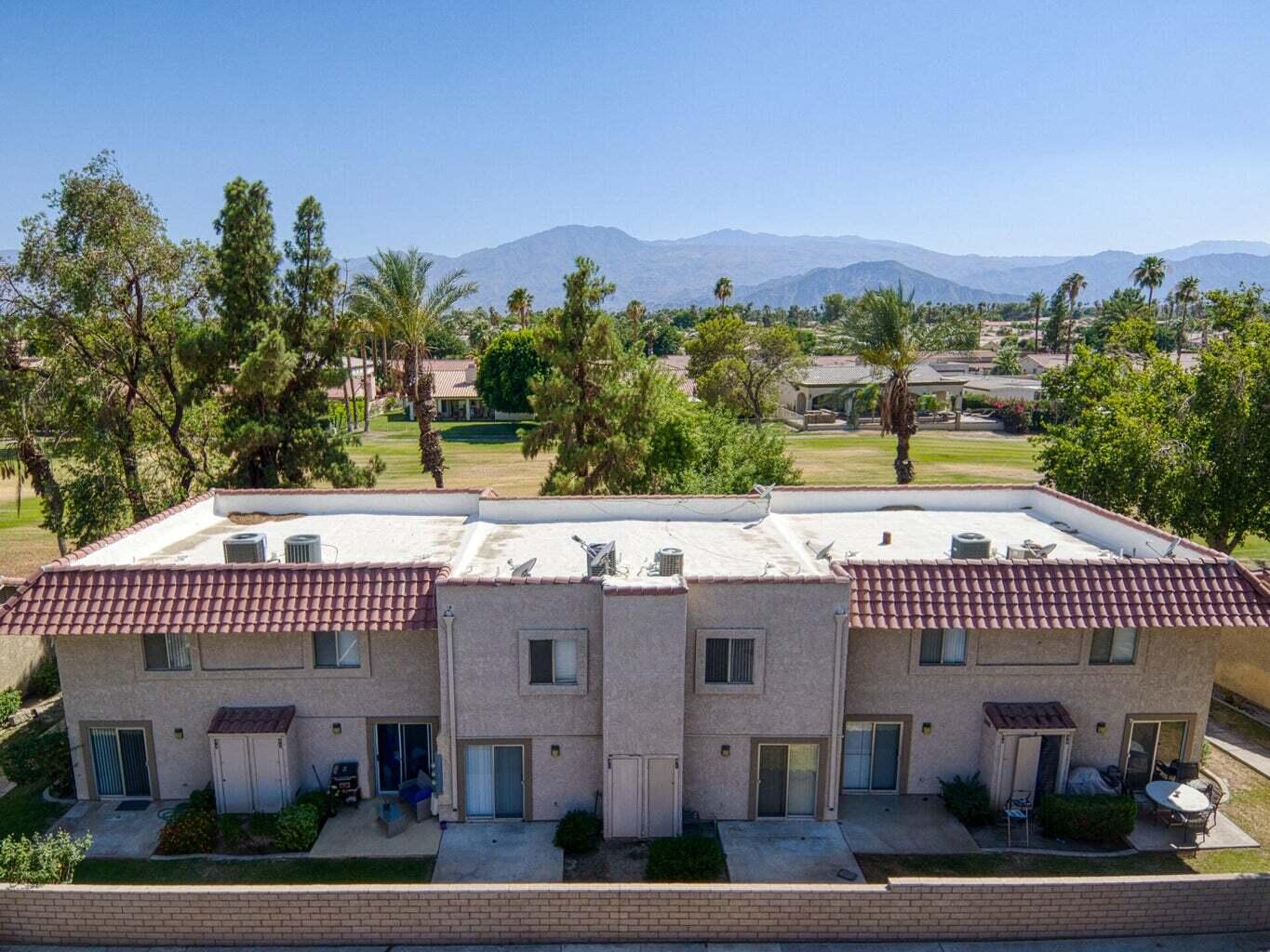 82567 Ave 48, Unit 44 Indio, CA 92201 - Photo 14 of 19 a view of a house with a floor to ceiling window next to a road