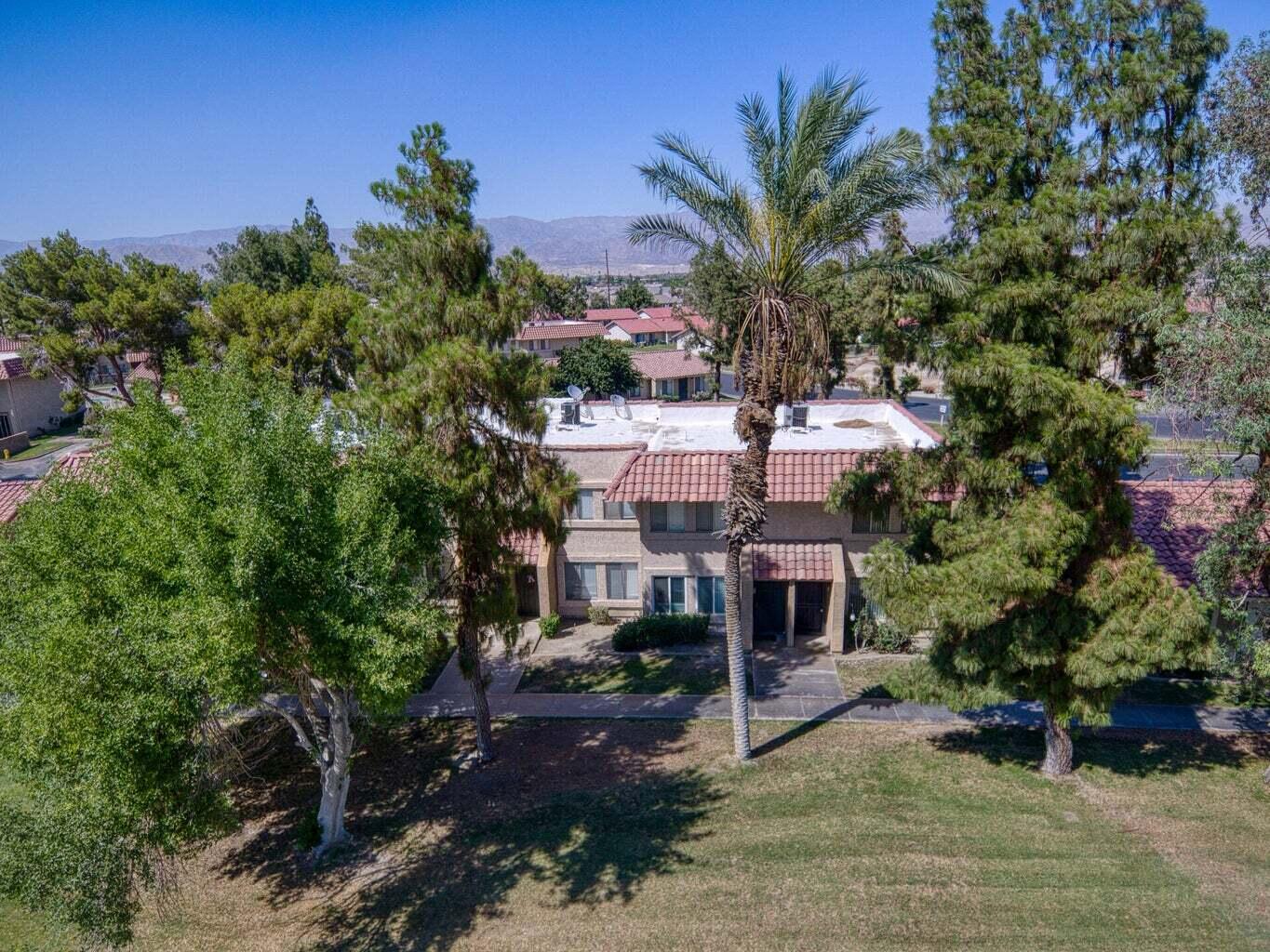 82567 Ave 48, Unit 44 Indio, CA 92201 - Photo 15 of 19 a view of a house with a yard