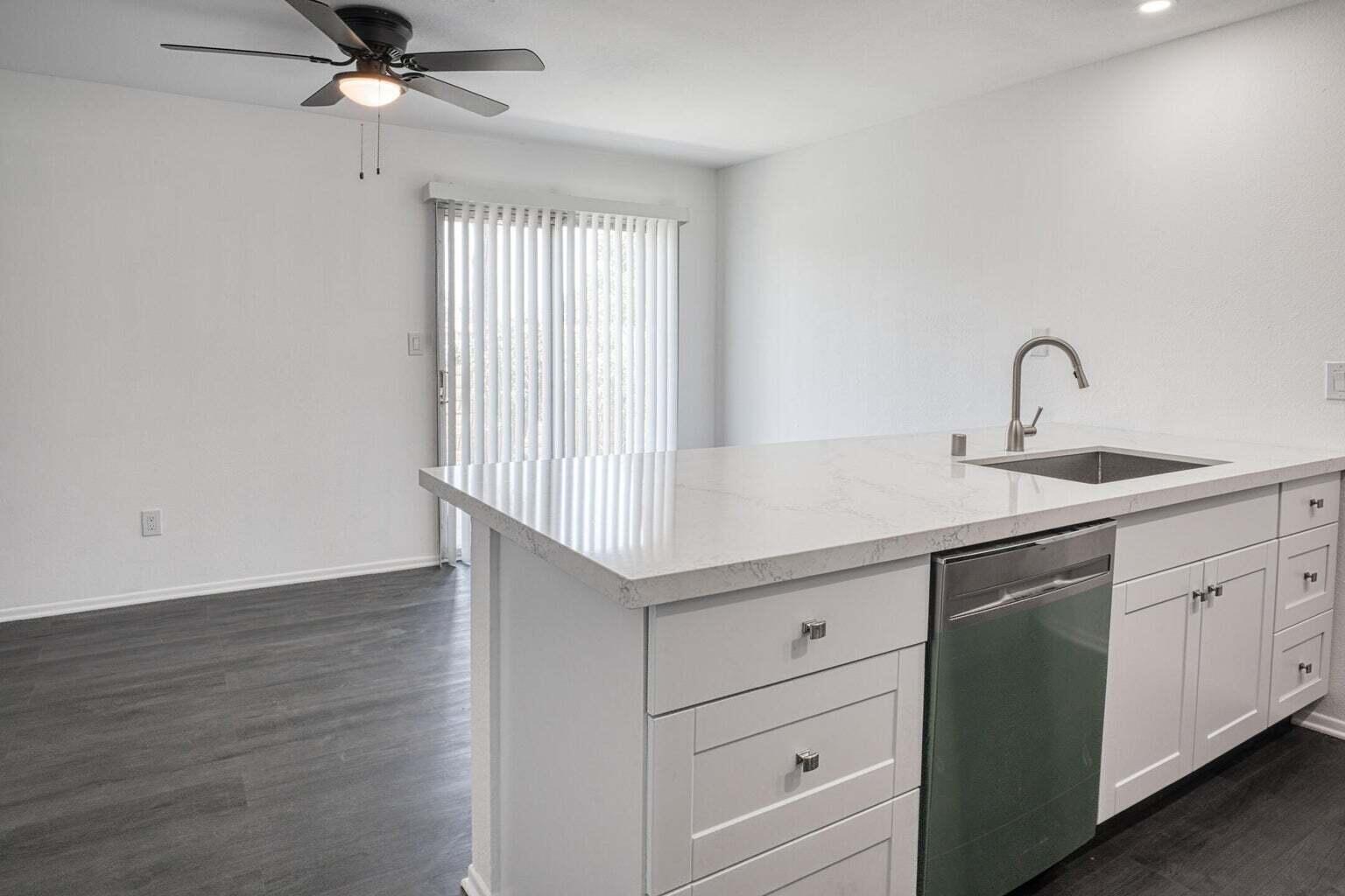 82567 Ave 48, Unit 44 Indio, CA 92201 - Photo 2 of 19 a kitchen with a sink cabinets and wooden floor