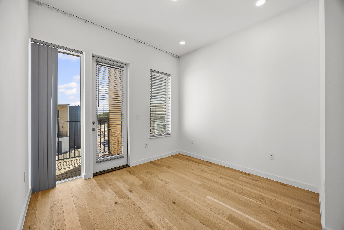 6020 Springdale Road, Unit 12 Austin, TX 78723 - Photo 17 of 28 an empty room with windows