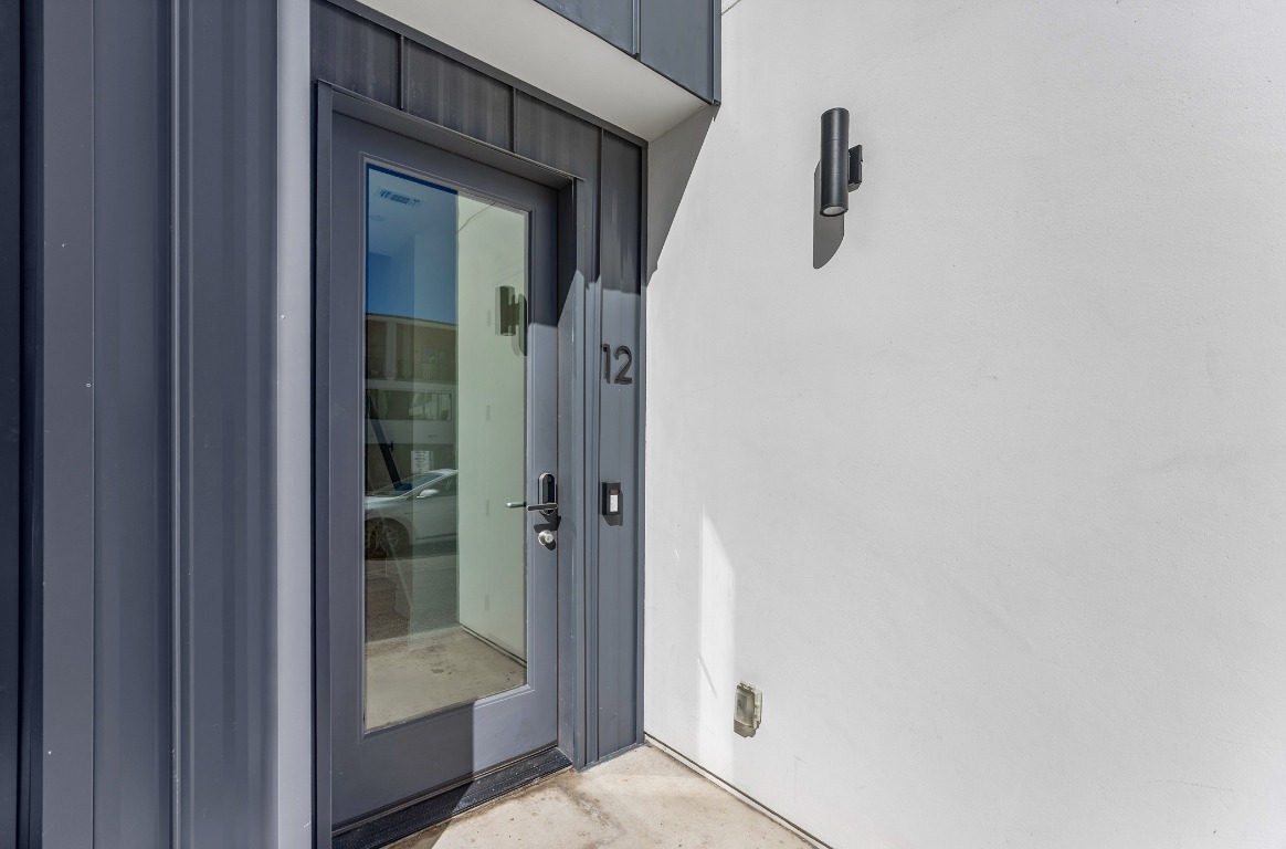 6020 Springdale Road, Unit 12 Austin, TX 78723 - Photo 23 of 28 a bathroom with a glass shower door