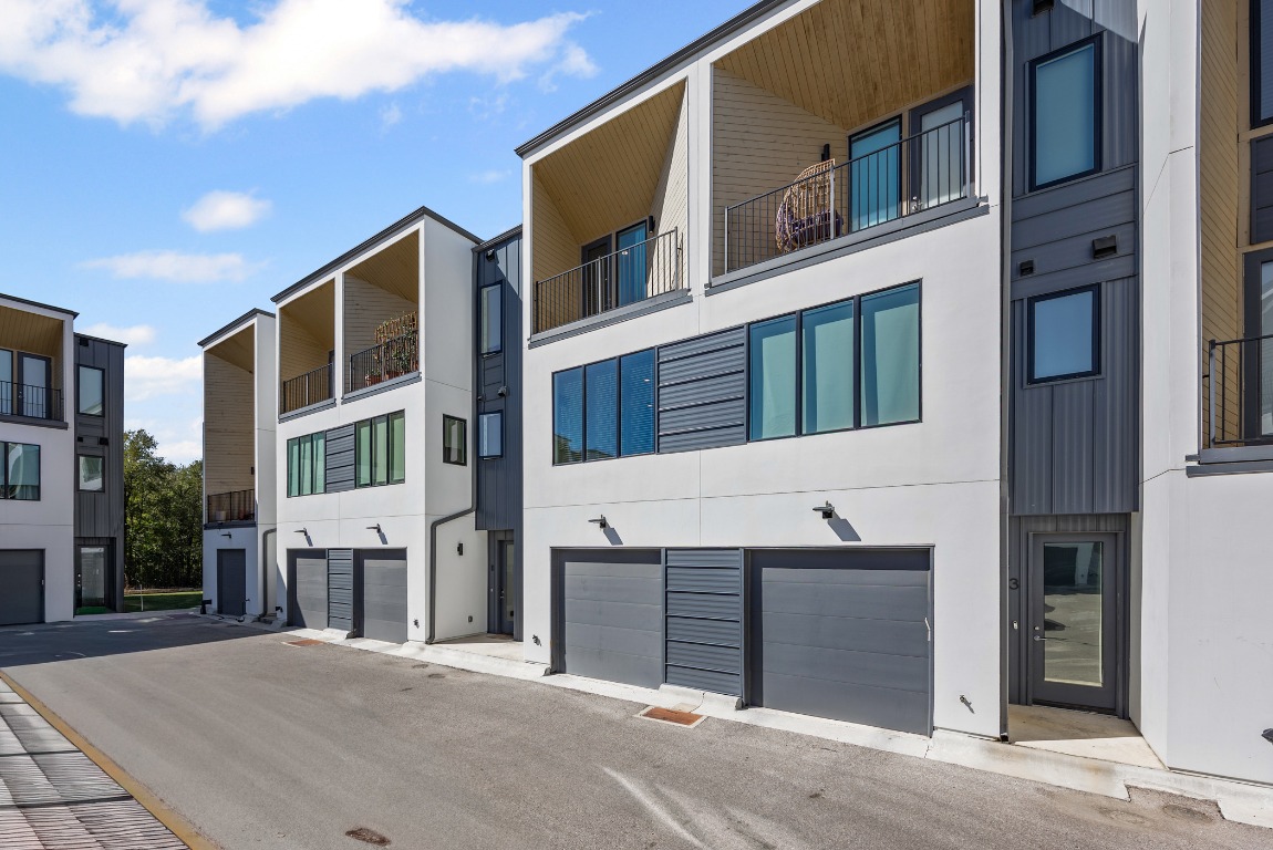 6020 Springdale Road, Unit 12 Austin, TX 78723 - Photo 24 of 28 a front view of residential houses with yard