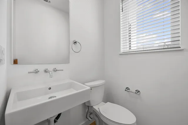 a bathroom with a sink a toilet and a bathtub