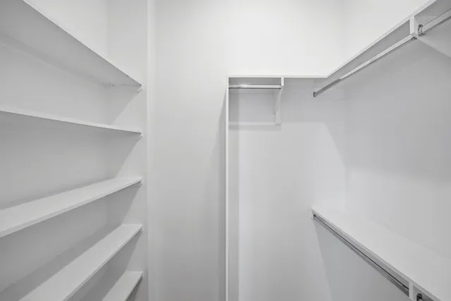 a view of an empty walk in closet