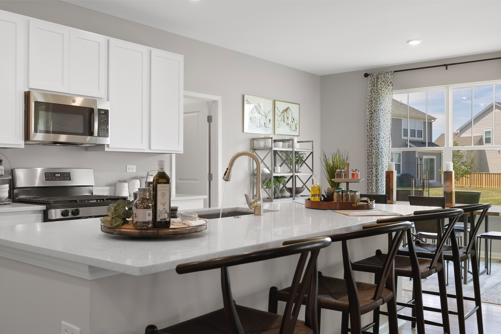 600 Lismore Circle Elgin, IL 60124 - Photo 3 of 20 a kitchen with a dining table chairs and cabinets