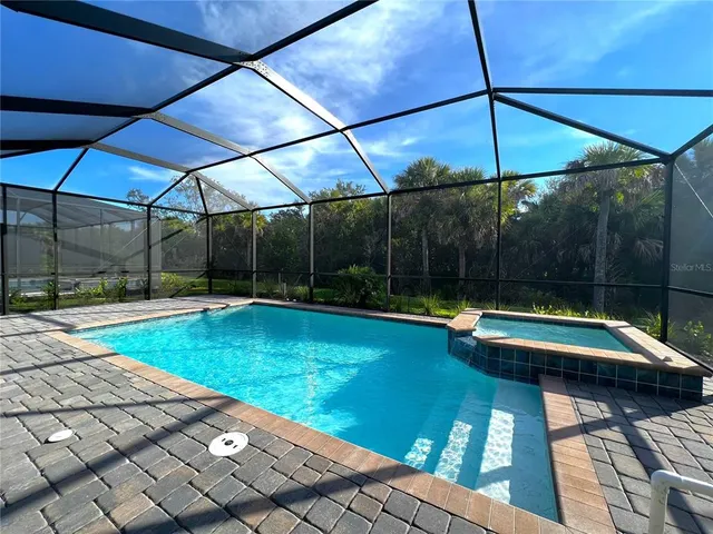 a view of swimming pool with a patio