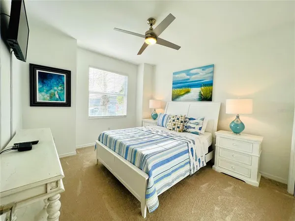 a bedroom with a bed and a desk