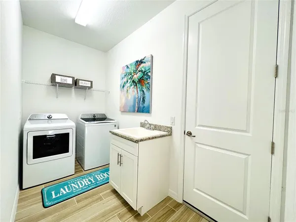 a utility room with dryer and washer