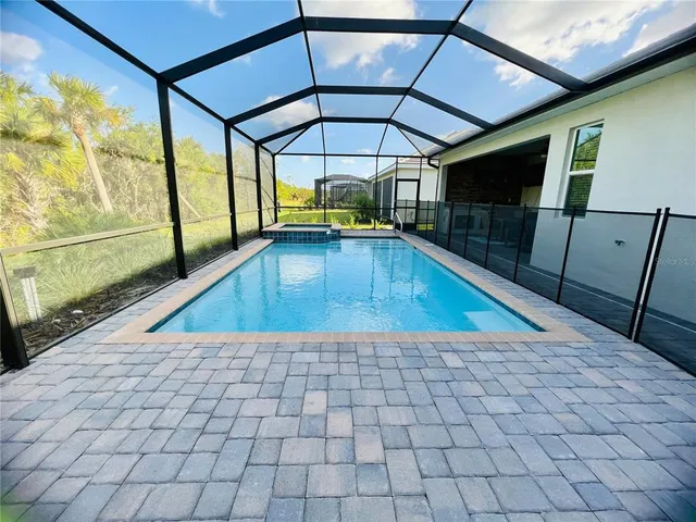 a view of a swimming pool with a porch