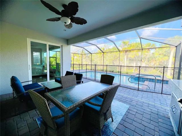 a view of a dining room with furniture window and outside view