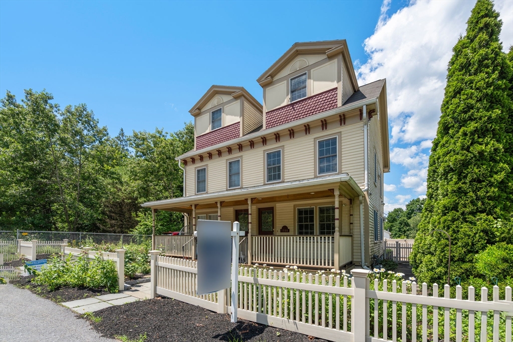 1844 Main Street, Unit 1 Concord, MA 01742 - Photo 32 of 36 a front view of a house with a porch