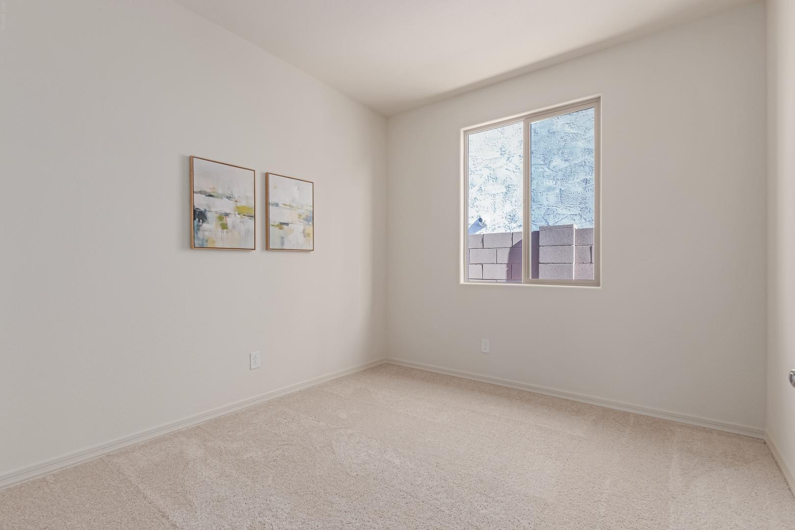 7143 West Coles Road Laveen, AZ 85339 - Photo 11 of 15 an empty room with a window