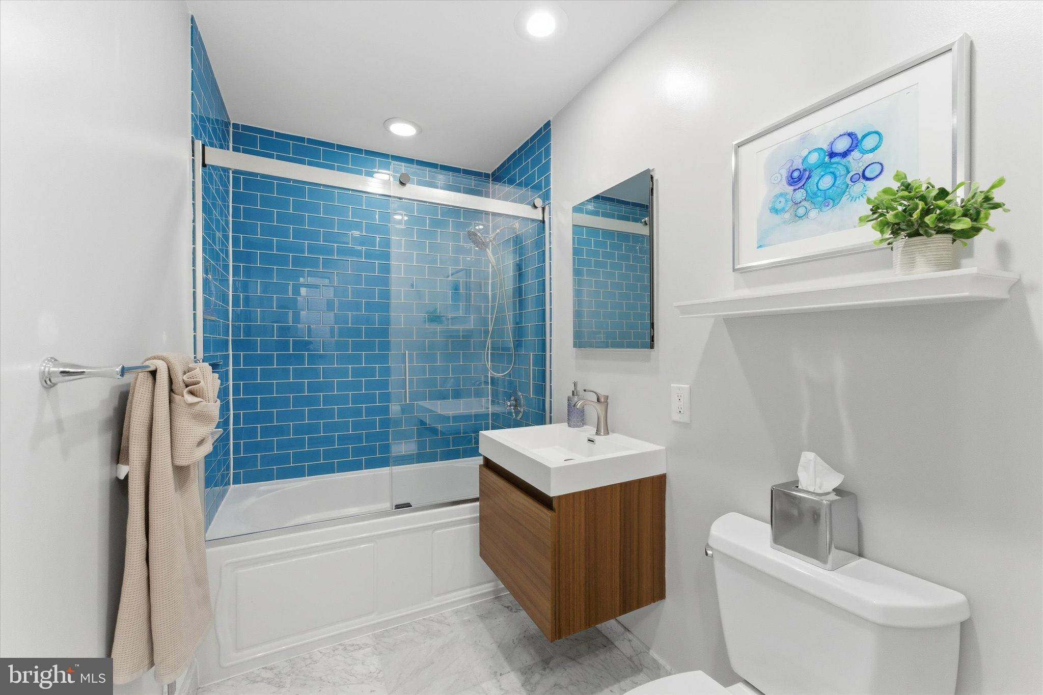 1378 4th Street Southwest Washington, DC 20024 - Photo 29 of 74 a bathroom with a sink a toilet and shower