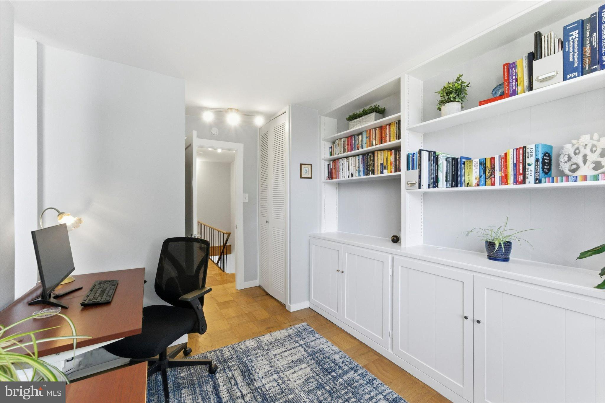 1378 4th Street Southwest Washington, DC 20024 - Photo 34 of 74 a view of a workspace with furniture and a book shelf