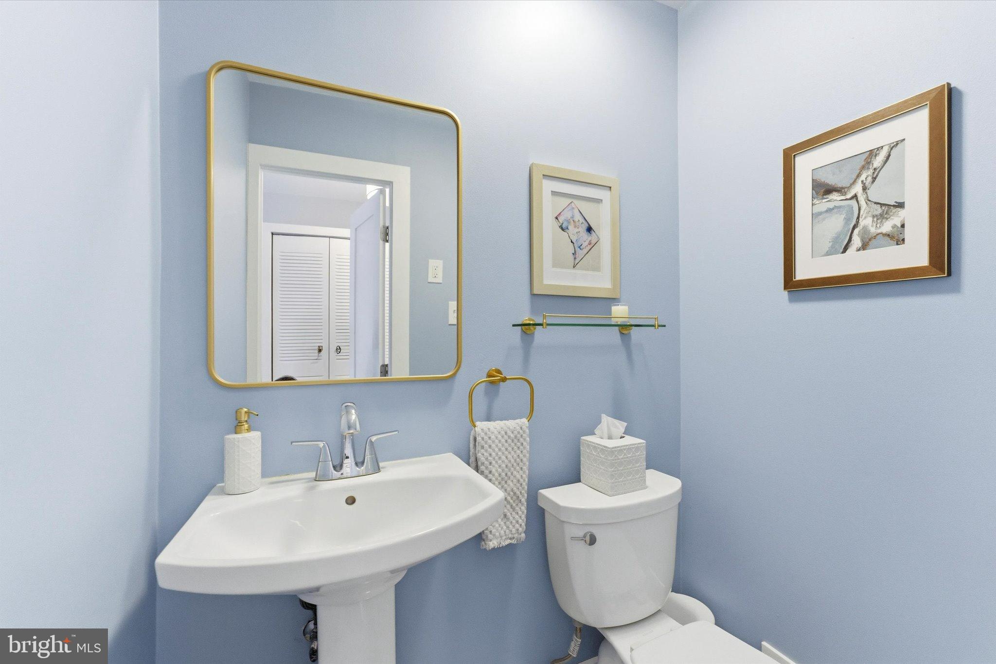 1378 4th Street Southwest Washington, DC 20024 - Photo 10 of 74 a bathroom with a toilet a sink and mirror