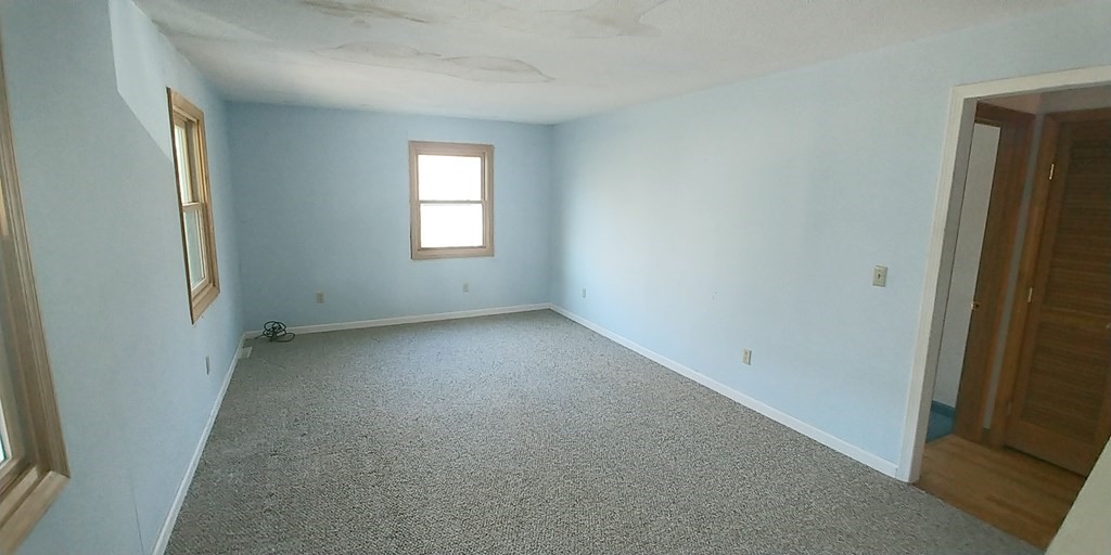 487 Chapin Road Hampden, MA 01036 - Photo 6 of 14 an empty room with windows