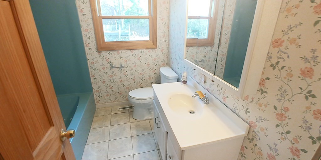 487 Chapin Road Hampden, MA 01036 - Photo 8 of 14 a bathroom with a sink a toilet and a window
