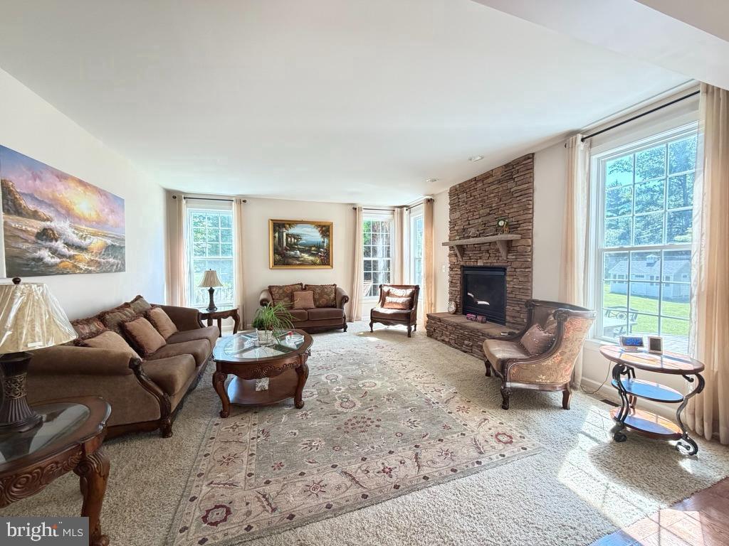 9804 Anvil Court Perry Hall, MD 21128 - Photo 9 of 21 a living room with furniture fireplace and a large window