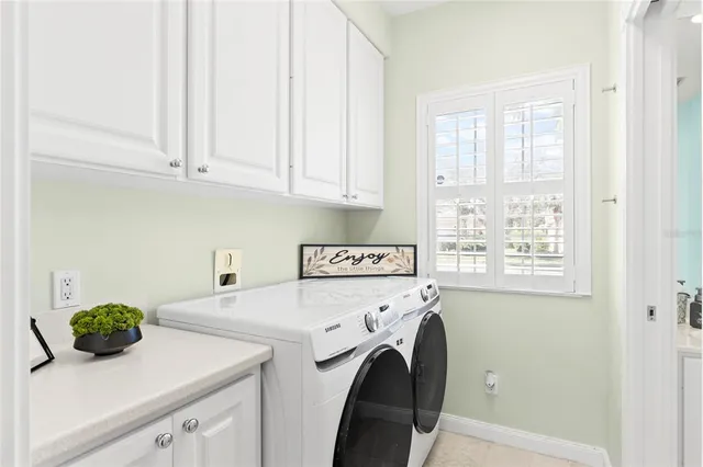 a bathroom with a window sink and mirror